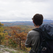 Student looking out at mountain range
