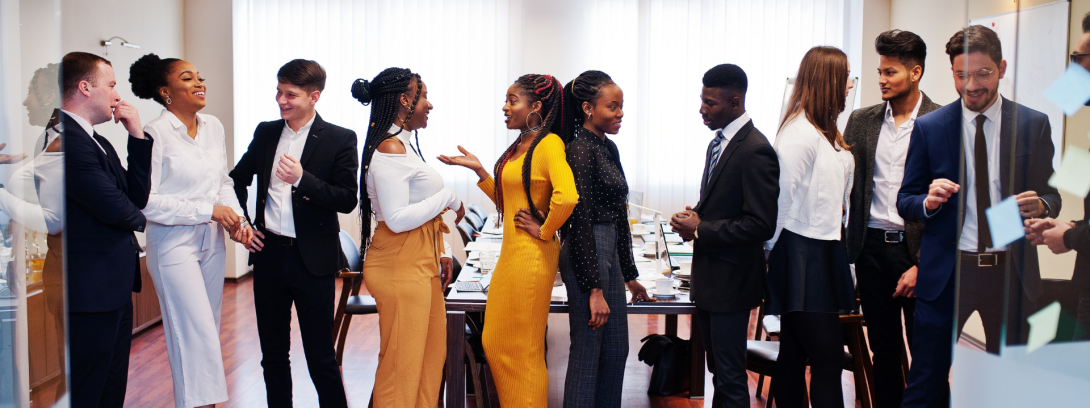A photo of a group of students engaging in conversation